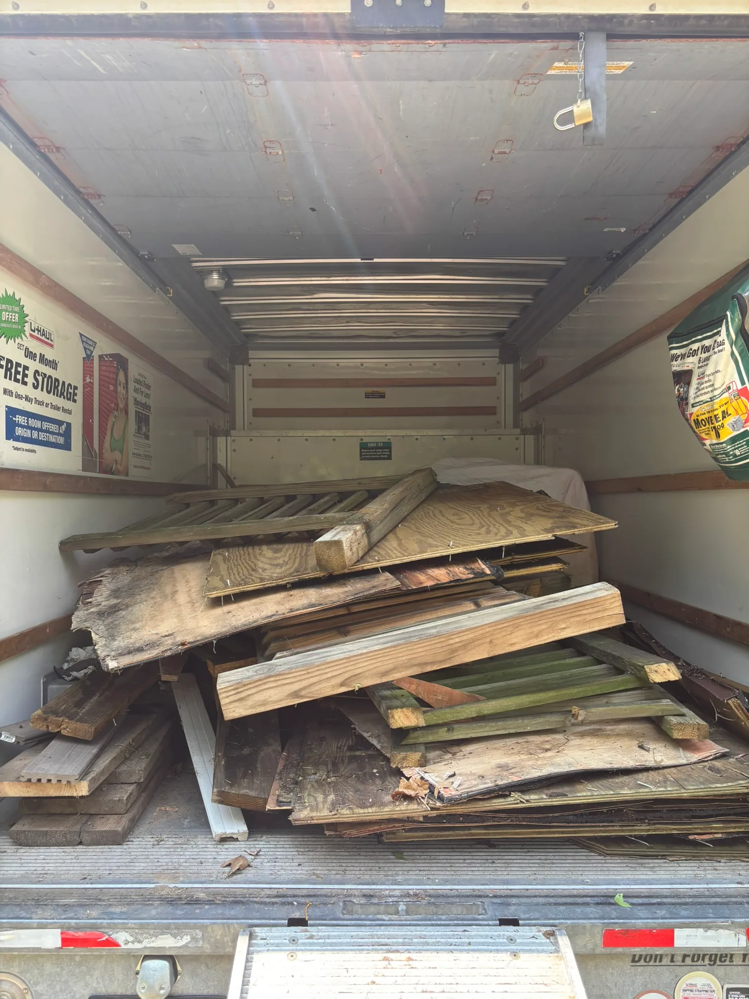 Junkernauts Junk Removal truck loaded with construction debris for hauling