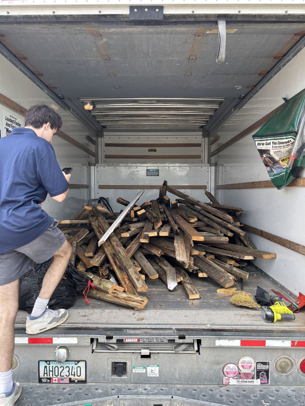 Truck loaded with removed deck boards and demolition debris
