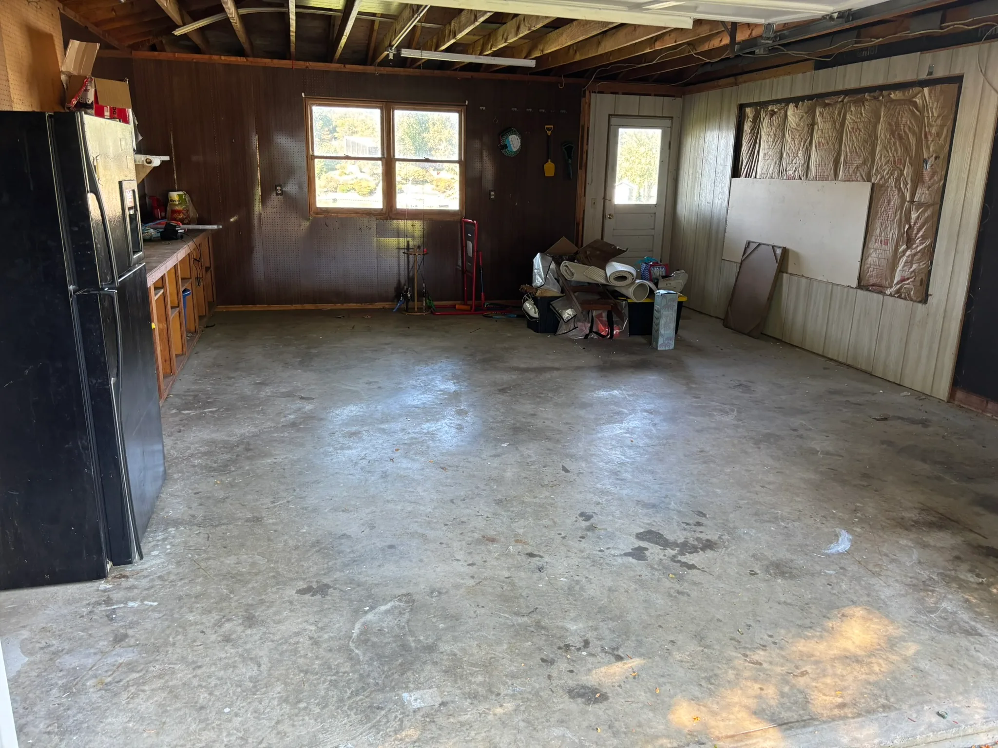 Open garage floor after a Junkernauts Junk Removal cleanout