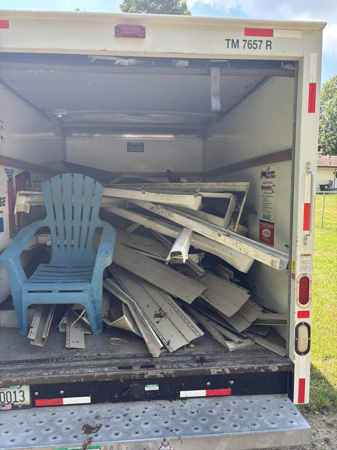 Junkernauts Junk Removal truck loaded with debris from a cleanup job