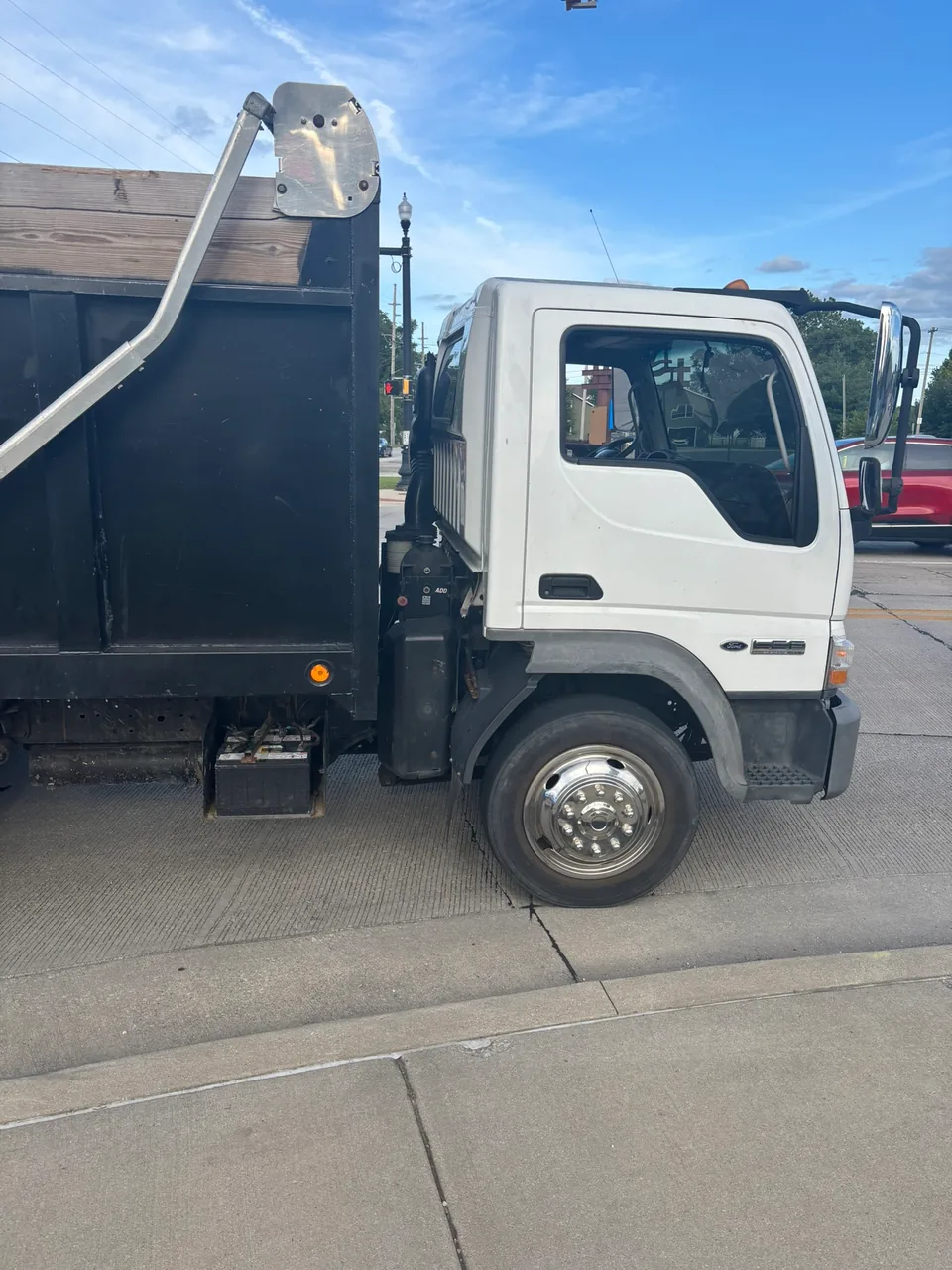 Junkernauts Junk Removal hauling truck parked at the curb